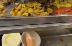 Heboh warung makan mencuci makanan sisa agar bisa dijual kembali. (dok. tangkapan layar video Facebook Silohna King via CNA)
