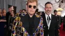 Elton John hadir bersama dengan suaminya, David Furnish. (CHRISTOPHER POLK / GETTY IMAGES NORTH AMERICA / AFP)