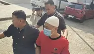 Tampang Taufik Hidayat Saat Rekonstruksi Penyekapan Kekasihnya