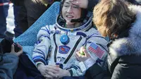 Christina Koch, astronot wanita NASA yang menyetak rekor karena paling lama berada di ruang angkasa. (Source: Sergei Ilnitsky/Pool Photo via AP)
