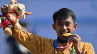 Pelari asal kontingen Jawa Tengah, Ammar&nbsp;Hudzaifah menjadi atlet pertama yang meraih medali emas di Peparnas XVII Solo 2024 di Stadion Sriwedari Solo Senin (7/10).(Liputan6.com/Dok PB Peparnas XVII)