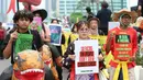 Pengunjuk rasa menegaskan bahwa pemerintah Indonesia harus serius memenuhi target pemangkasan emisi karbon sebesar 23 persen pada 2035. (Kapanlagi.com/ Budy Santoso)