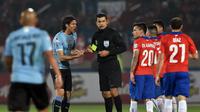 Sandro Ricci, wasit Cile vs Uruguay (AFP/Rodrigo Arangua)