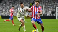 Gelandang Real Madrid, Dani Ceballos, tampil impresif ketika timnya bermain imbang 1-1 kontra Atletico Madrid pada laga pekan ke-23 La Liga di Santiago Bernabeu, Madrid, Minggu (09/02/2025) dini hari WIB. (AP&nbsp;Photo/Manu Fernandez)