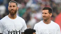 Sergio Ramos merupakan rival sengit Messi di Liga Spanyol yang saat ini berubah menjadi partner satu tim. Mereka didatangkan menuju Paris Saint-Germain pada bursa transfer musim panas ini. Ramos juga sempat bermain dengan Cristiano Ronaldo ketika membela Real Madrid. (Foto: AFP/Bertrand Guay)