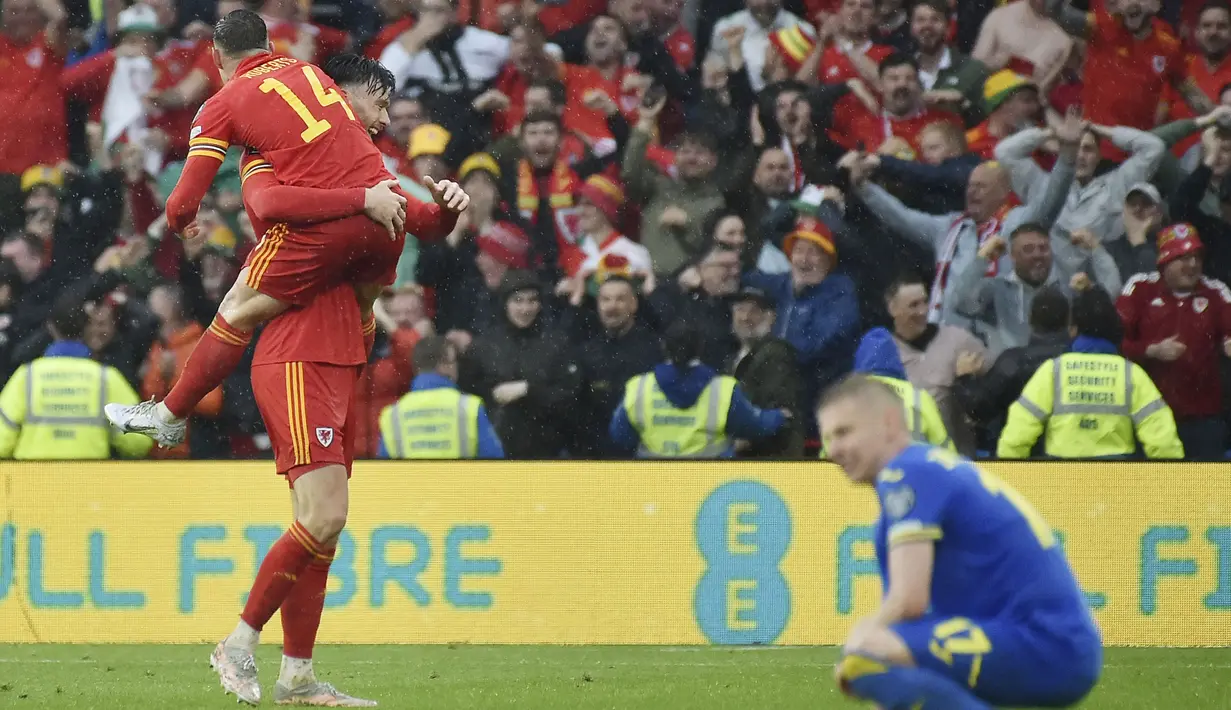Kepastian itu didapat Wales usai menaklukkan Ukraina pada laga final Path A Playoff Piala Dunia 2022 Zona Eropa. (AP/Rui Vieira)