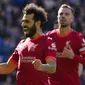 Penyerang Liverpool, Mohamed Salah merayakan setelah mencetak gol kedua timnya melalui tendangan penalti ke gawang Brighton and Hove Albion dalam lanjutan Liga Inggris di Stadion Amex di Brighton, Inggris, Sabtu (12/3/2022) malam WIB. (AP Photo/Kirsty Wigglesworth )