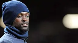 Ekspresi striker Manchester City Emmanuel Adebayor jelang leg kedua semifinal Carling Cup melawan Manchester United di Old Trafford, 27 Januari 2010. AFP PHOTO / PAUL ELLIS