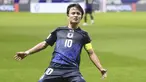 Pemain Jepang, Takefusa Kubo melakukan selebrasi setelah mencetak gol ke gawang Timnas Indonesia dibayangi Mees Hilgers dalam laga Grup C Putaran Ketiga Kualifikasi Piala Dunia 2026 di Suita Stadium, Jepang, Selasa (10/06/2025). (AP Photo/Kyodo News/Shohei Miyano)