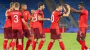 Pemain Swiss merayakan gol yang dicetak oleh Silvan Widmer ke gawang Jerman pada laga UEFA Nations League di Stadion St. Jakob-Park, Senin, (7/9/2020). Kedua tim bermain imbang 1-1. (Georgios Kefalas/Keystone via AP)