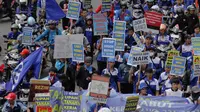 Ribuan buruh melakukan aksi mogok nasional menuntut pemerintahan Jokowi-JK membatalkan kenaikan BBM dan menaikan upah layak untuk buruh. (Liputan6.com/Faizal Fanani)