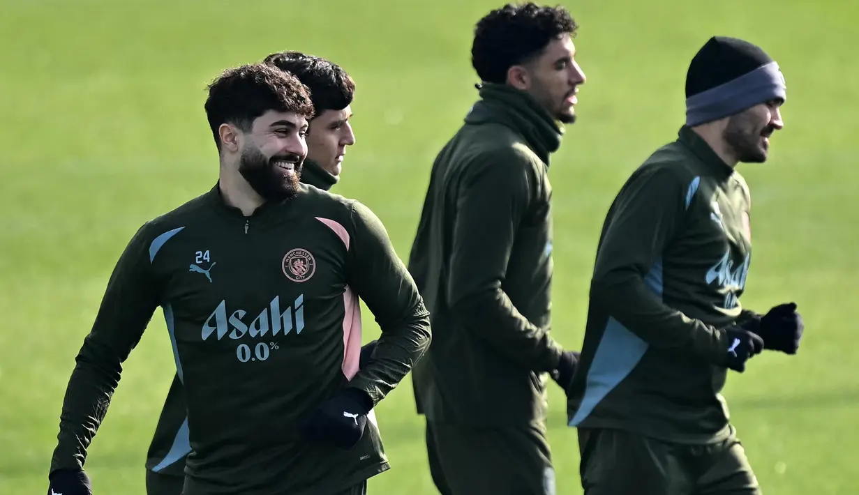 Manchester City akan bertandang ke Santiago Bernabeu melawan Real Madrid pada leg kedua play-off fase gugur Liga Champions 2024/2025. (Paul ELLIS/AFP)