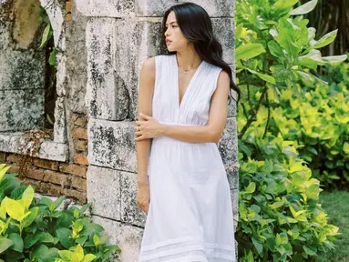 Di tengah-tengah liburannya di Pulau Dewata, Maudy Ayunda sempat menjalani pemotretan di sebuah resort mewah yang terletak di kawasan Uluwatu, Bali. Ia tampak berpose candid sambil mengenakan long dress berwarna putih. (Liputan6.com/IG/@maudyayunda)