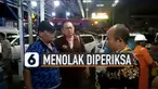 Sebuah video yang menunjukkan sejumlah pejabat protes saat hendak dilakukan tes medis terkait virus Corona, viral di media sosial.