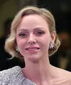 Princess Charlene tampil dengan cincin berlian berpotongan besar yang jarang ia gunakan di depan publik. (VALERY HACHE / AFP)