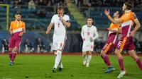 Harry Kane berhasil mencetak empat gol saat Timnas Inggris menang 10-0 atas San Marino pada laga terakhir Grup I kualifikasi Piala Dunia 2022 di San Marino Stadium, Selasa (16/11/2021) dini hari WIB. (AP Photo/Antonio Calanni)