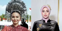 Margin Wieheerm tampil elegan dalam kebaya janggan merah berlis putih yang dipadukan dengan kain batik bernuansa senada. Hijab merah dan bros emas menjadi pelengkap yang mempertegas kesan anggun sekaligus patriotik. [@marginw].