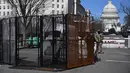 Anggota Garda Nasional berpatroli di dekat Gedung Capitol AS di Capitol Hill, Washington, DC. Rabu (3/3/2021).Kepolisian meningkatkan keamanan di wilayah Washington DC, setelah intelijen menemukan dugaan plot terbaru untuk 'menembus Capitol' pada Kamis (4/3) waktu setempat. (Eric BARADAT/AFP)