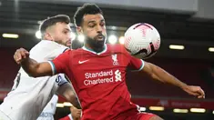 Mohamed Salah mencetak gol ke-100 nya saat Liverpool mengalahkan Leeds United dengan skor 3-0 pada Minggu (12/09/2021) malam WIB. Pertandingan tersebut merupakan laga ke-162 Salah bersama The Reds. (Foto: AFP/Pool/Shaun Botterill)
