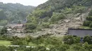 Lokasi longsor di Karatsu, prefektur Saga, Jepang selatan Senin, 10 Juli 2023. (Kyodo News via AP)