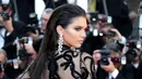 Kendall Jenner, model berusia 20 tahun itu memang memiliki talenta yang luar biasa. Selai  piawai melenggang di catwalk runaway ia juga sukses memiliki brand swimwear bersama Kylie Jenner. (AFP/Bintang.com)