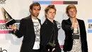 Christopher Wolstenholme, Matthew Bellamy, dan Dominic Howard yang tergabung dalam grup band Muse menambahkan daftar konser mereka di Britania Raya. (Bintang/EPA)