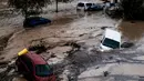 Banjir bandang disebabkan hujan deras yang menyebabkan sungai-sungai meluap. (AP Photo/Gregorio Marrero)
