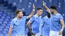 Skuat Lazio musim 2020/2021 ini didominasi oleh para legiun asing dari luar Italia yang membawa Lazio lolos hingga babak 16 besar Liga Champions sebelum disingkirkan Bayern Munich. Hanya ada 5 pemain asli Italia dalam skuat asuhan Simone Inzaghi. Siapa saja mereka? (AFP/Alberto Pizzoli)
