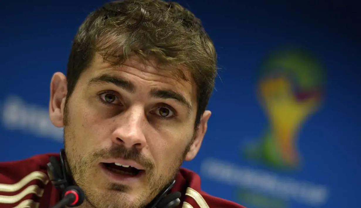 Iker Casillas menegaskan bahwa target timnya di Piala Dunia 2014 adalah untuk mempertahankan trofi yang sudah berhasil mereka rebut empat tahun silam, Brasil, Jumat (13/6/2014) (AFP Photo/LLUIS GENE).