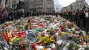 Ribuan warga ambil bagian dalam pawai menentang teror dan kebencian di Brussels, ibu kota Belgia, Minggu (17/4). Aksi yang berlangsung dengan tenang dan ‘tanpa suara’ ini untuk menunjukkan persatuan usai serangan teroris di Brussels. (REUTERS/Yves Herman)