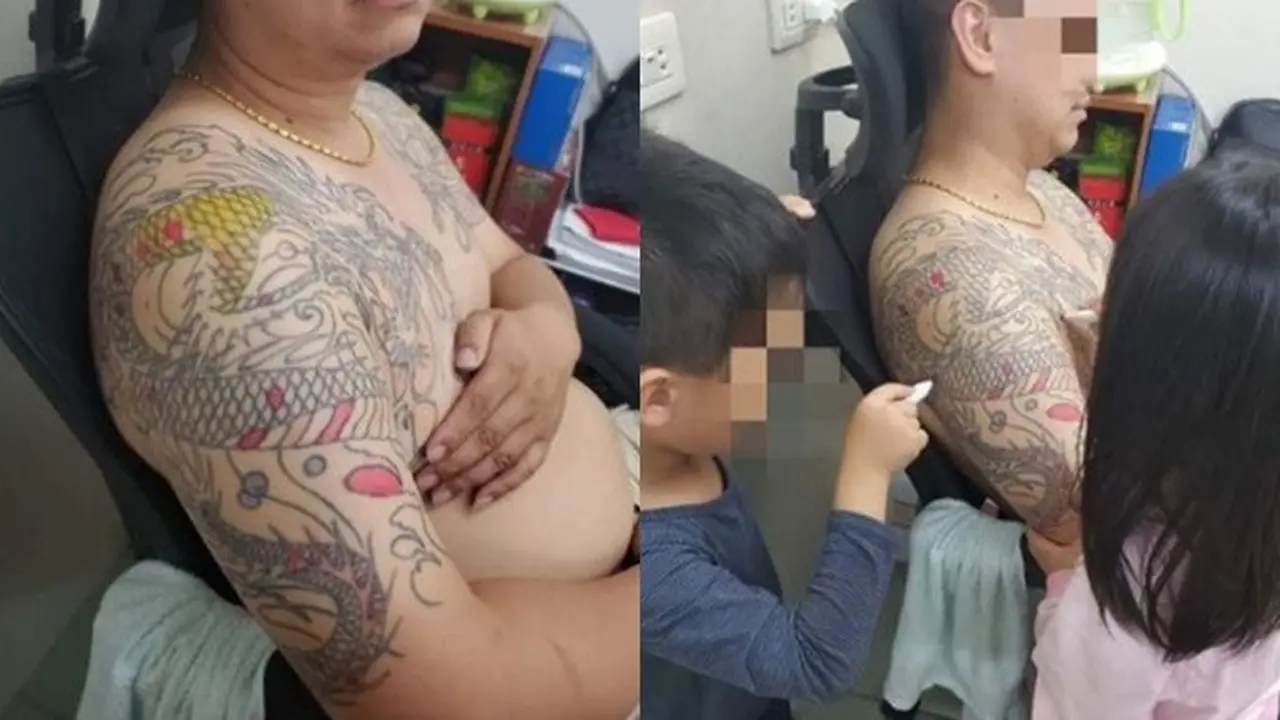 Punya Tato Naga Besar, Ayah Ini Jadi Buku Gambar Untuk Anaknya