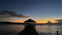 Sunset di kawasan pariwisata pantai Paradise Desa Maen - Likupang, Sumatera Utara, 10 Agustus 2022. (Liputan6.com/Yulia Lisnawati)