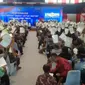 Ribuan warga Banyuwangi secara simbolis menerima sertifikat tanah elektronik dari Presiden Jokowi di GOR Tawangalun Banyuwangi (Hermawan Arifianto/Liputan6.com)