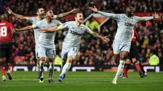 Pemain Derby County merayakan kemenangan atas  Manchester United pada Piala Liga Inggris di Stadion Old Trafford, Rabu (26/9/2018). Manchester United takluk adu penalti 9-10 (2-2) dari Derby County. (AFP/Paul Ellis)