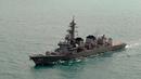 Sebuah foto udara menunjukkan kapal Angkatan Laut Jepang yang membantu mencari puing-puing AirAsia QZ8501, Laut Jawa, Rabu (7/1/2015). (AFP Photo/Dewanto Samodro)