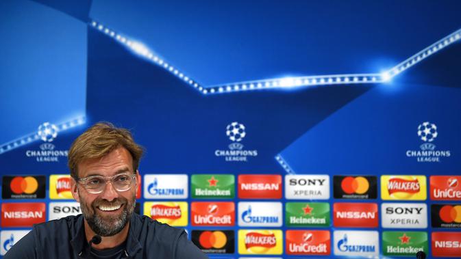 Jurgen Klopp mengungkapkan alasan mengapa dirinya lebih tertarik melatih Liverpool dibandingkan Manchester United. (Paul ELLIS / AFP)
