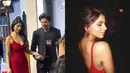 Gaun menyentuh lantai berwarna merah berkilauan ini dipadukan dengan aksesori minimalis, seperti anting dan cincin dari Goenka India. Warna merah, khususnya dalam tema "Tomato Girl Fall," mendominasi karpet merah dan tren fesyen. Suhana Khan tampil menawan bersanding dengan sang ayah. (Liputan6.com/IG/@varinderchhawla dan @suhanakhaan)
