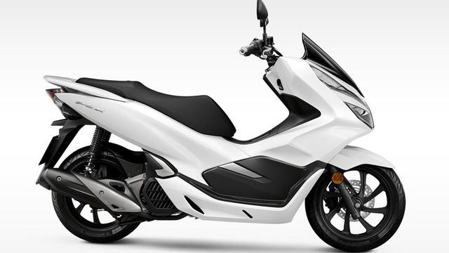 Ilustrasi sepeda motor berwarna putih (motortrade.com.ph)