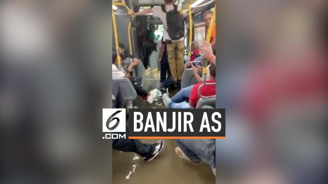 Hujan deras terjadi di Manhattan, AS dan menyebabkan banjir di sebagian kota. Air bahkan masuk ke dalam bus yang sedang melintas mengantkut penumpang.