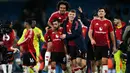 Pemain Manchester United, Bruno Fernandes (kedua kiri) bersama Joshua Zirkzee (tengah) dan Rasmus Hojlund (kedua kanan) melakukan selebrasi usai pertandingan sepak bola Liga Premier Inggris melawan Manchester City di Stadion Etihad, Manchester, Inggris, pada 15 Desember 2024. (Paul ELLIS/AFP)
