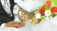 Ilustrasi &ndash; Pasangan pengantin . (Foto: Liputan6.com/Muhamad Ridlo)