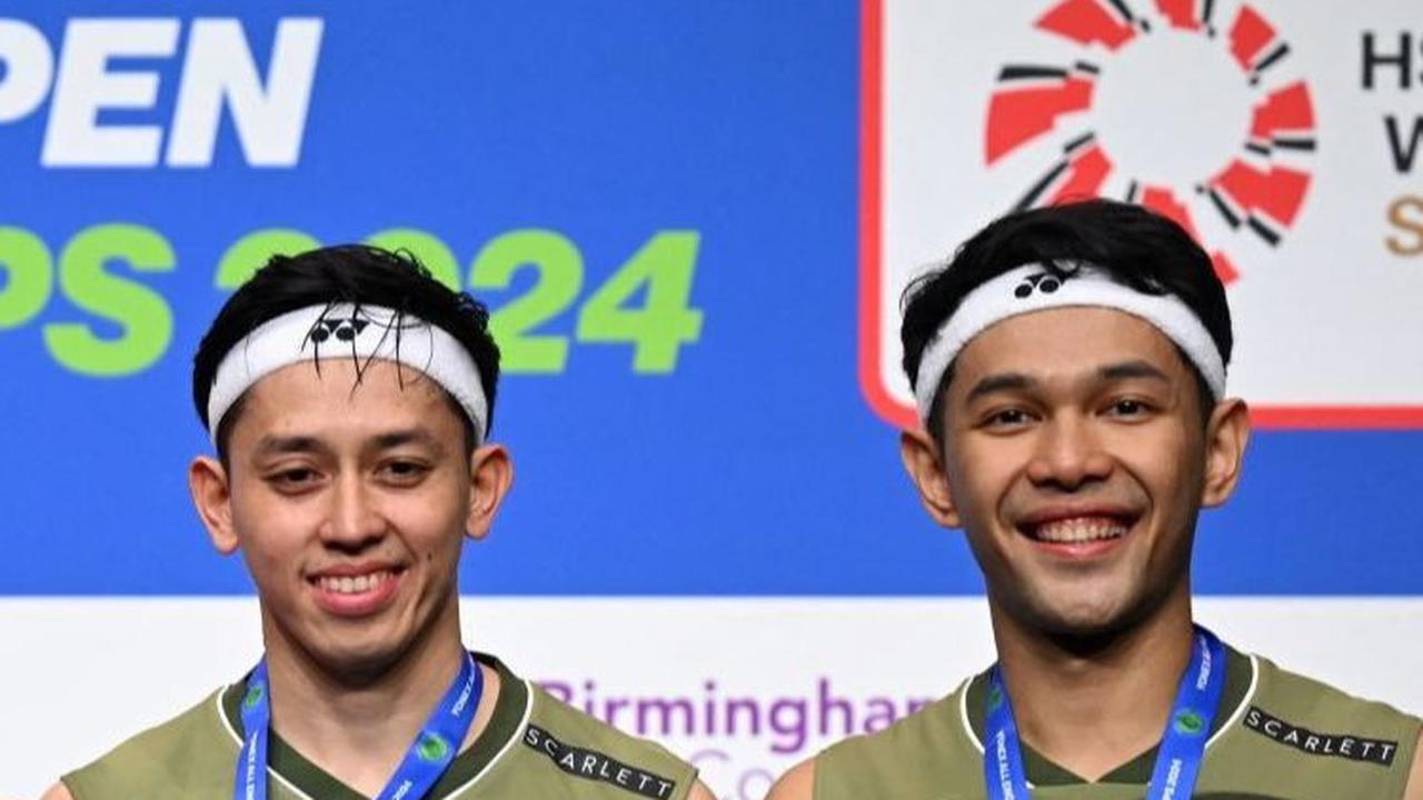 Meskipun mereka meraih prestasi yang mentereng, Fajar/Rian tetap ingin tampil konsisten dan berprestasi di setiap turnamen selanjutnya. Foto: JUSTIN TALLIS / AFP<br>