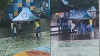 Aksi kocak siswa saat hujan deras demi bantu para siswi (Sumber: Twitter/jawashitpost)