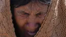 Ekspresi seorang wanita suku Aymara saat berdoa pada hari puasa sebagai ritual meminta hujan di Gunung Suci Inca Pucara, Chiquipata, Bolivia, Rabu (16/11/2022). Penduduk dataran tinggi La Paz mengatakan rendahnya curah hujan yang terjadi sejak September membuat mereka tidak bisa menanam kentang, buncis, dan kacang polong. (AP Photo/Juan Karita)