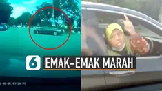 Ketegangan berlanjut, ibu-ibu pengendara sedan hitam meneriaki di lampu merah.
