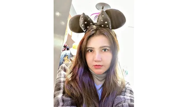 Penyuka kartun dan boneka membuat Disneyland menjadi destinasi utama Via di Jepang.