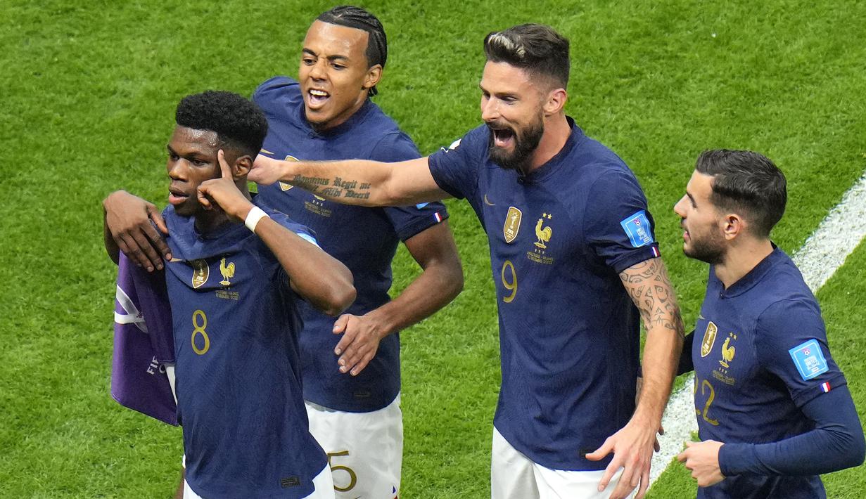 Enam menit kemudian akhirnya Prancis sudah mampu unggul 1-0 berkat gol Aurelien Tchouameni. Bola tembakan kerasnya dari  luar kotak penalti yang mengarah ke pojok kiri gawang tak mampu dijangkau Jordan Pickford. (AP/Hassan Ammar)