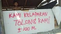 Korban gempa-tsunami Palu dan Donggala, Sulawesi Tengah menuliskan kalimat harapan dan permintaan di sejumlah tempat. (Liputan6.com/ Ady Anugrahadi)