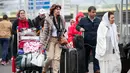 Orang-orang yang berada di Bandara Orly di Paris, Prancis, dievakuasi menyusul sebuah insiden penembakan yang terjadi pada Sabtu, (18/3). (AP Photo)