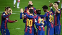 Barcelona meraih kemenangan 5-1 atas Deportivo Alaves pada laga pekan ke-23 La Liga di Camp Nou, Minggu (14/2/2021) dini hari WIB. Dua dari lima gol Barca disarangkan Lionel Messi. (AFP/Lluis Gene)